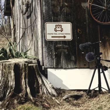 field recording rig in front of old shed and tree stump